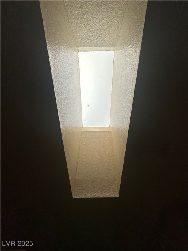 Interior details featuring a textured ceiling | Image 21