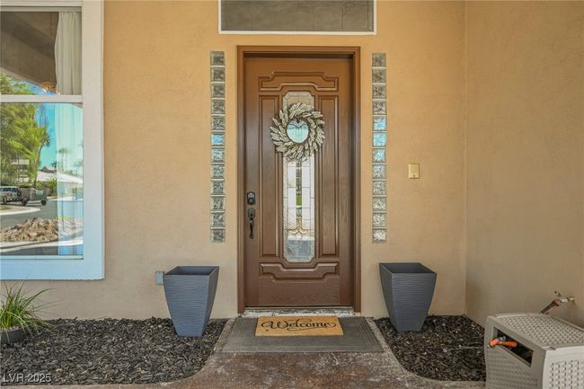 Entrance to property with stucco siding | Image 5