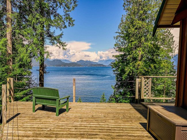 Dock area featuring a water and mountain view | Image 4