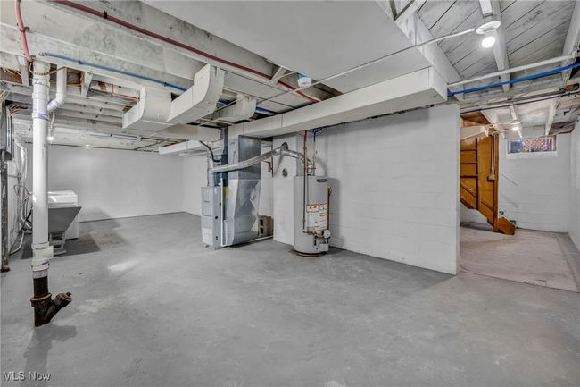Basement with water heater and heating unit | Image 26