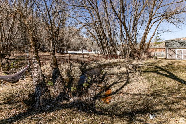 View of yard featuring fence | Image 32
