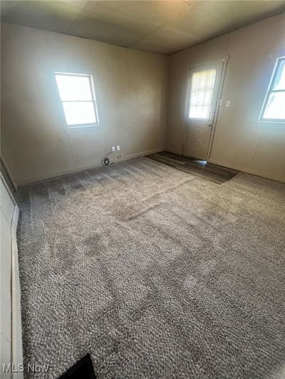 Unfurnished room with carpet floors | Image 2