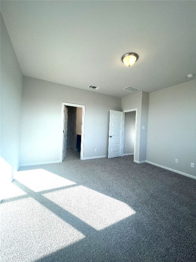 Unfurnished bedroom with carpet and baseboards | Image 10