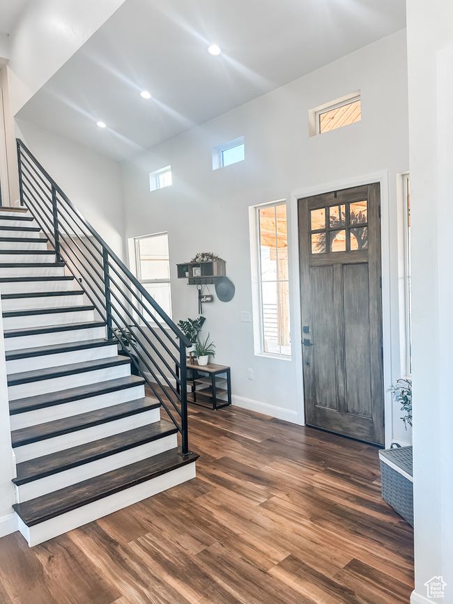 Entryway with baseboards, recessed lighting, stairway, dark wood-type flooring, and a high ceiling | Image 21