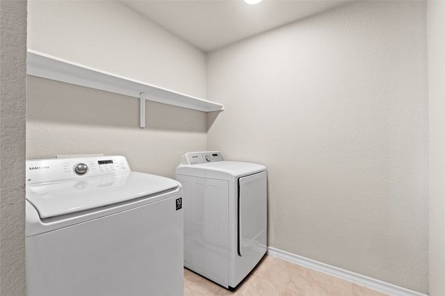 Extra large laundry room located upstairs | Image 25