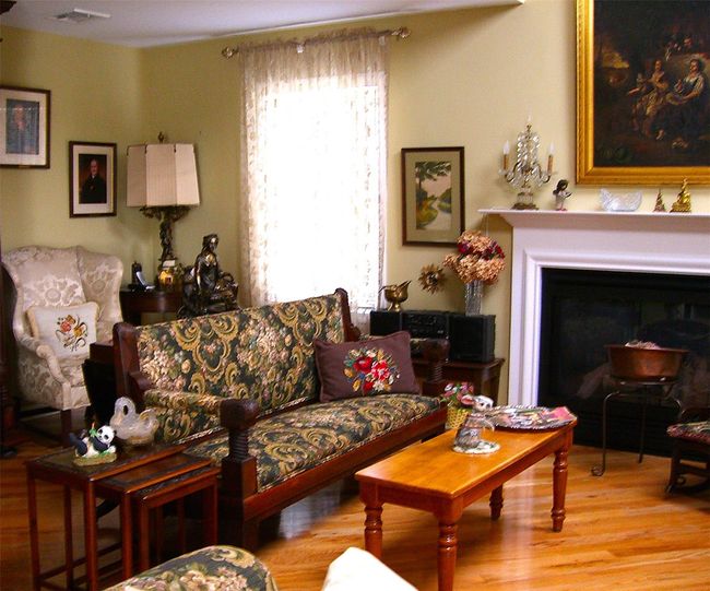 Living area with wood finished floors and a glass covered fireplace | Image 18