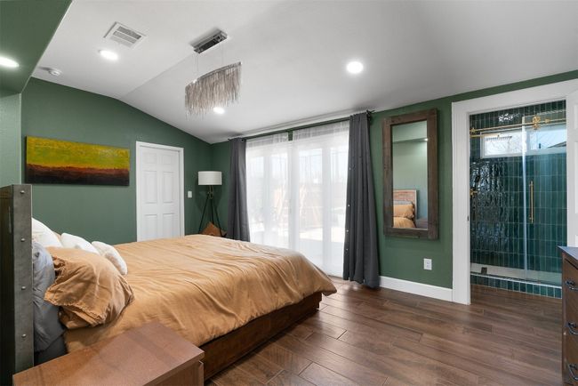 Spacious and inviting, the primary suite offers ample room for relaxation, with enough space for your favorite furniture and a peaceful atmosphere that encourages rest | Image 13