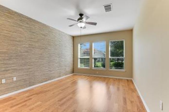 Spare room featuring wood finished floors and ceiling fan | Image 6