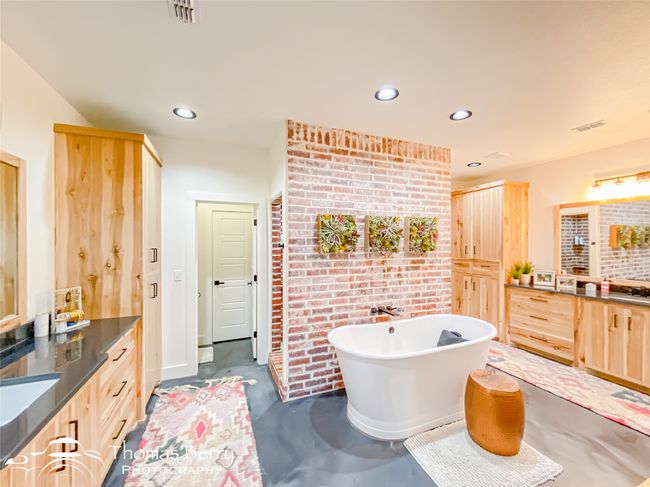 Bathroom with vanity, concrete floors, visible vents, a freestanding bath, and recessed lighting | Image 14