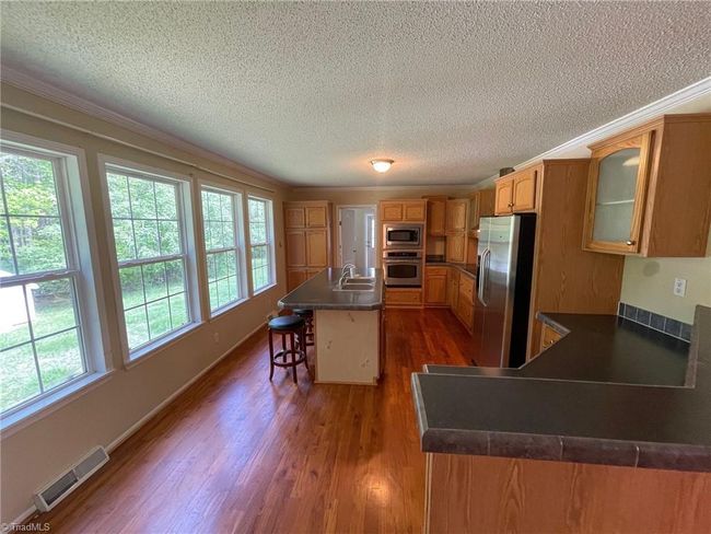 8004 Smithstone Ct, House other with 3 bedrooms, 2 bathrooms and null parking in Summerfield NC | Image 6