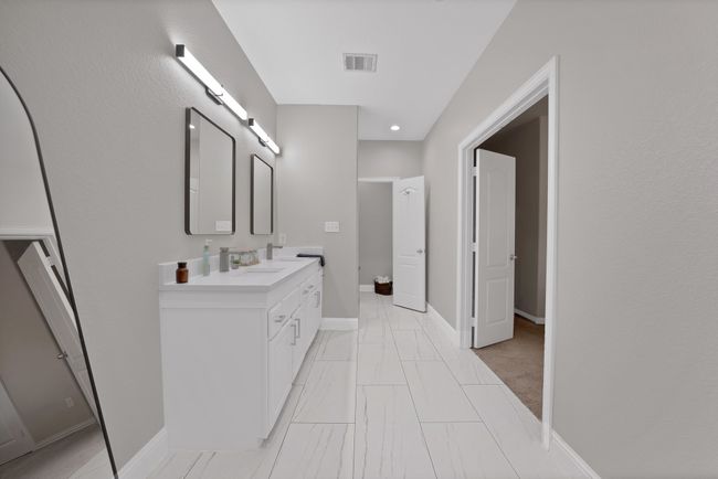 Full bathroom with double vanity, baseboards, marble look tile flooring, and recessed lighting | Image 36