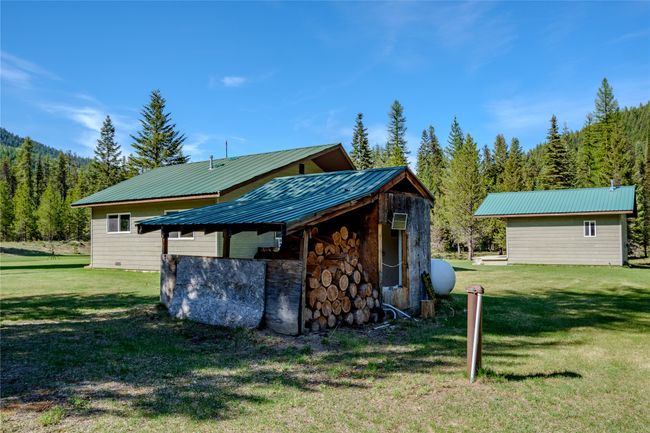 View of outdoor structure featuring a wooded view | Image 73