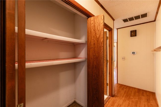 extra closet space next to guest bath | Image 32