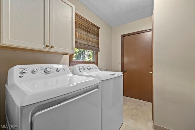 1st floor Laundry area with washer, dryer & util. sink | Image 27