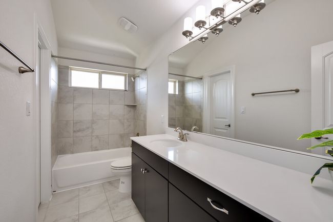 Full bathroom featuring vanity and shower / bathtub combination | Image 32