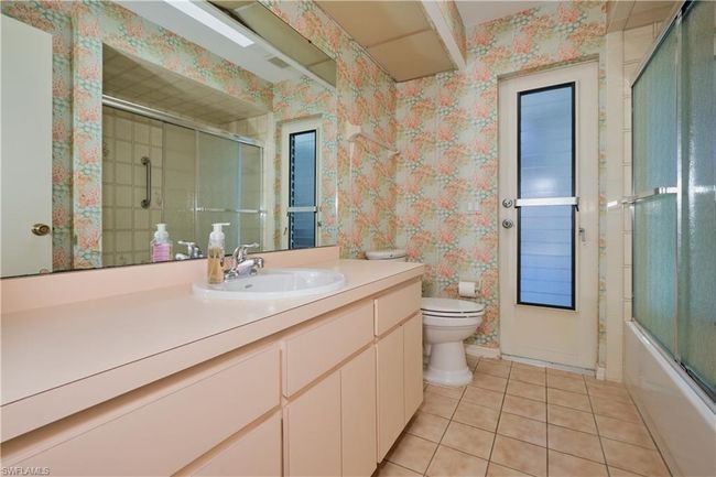 Guest Bathroom with Pool Door. | Image 18