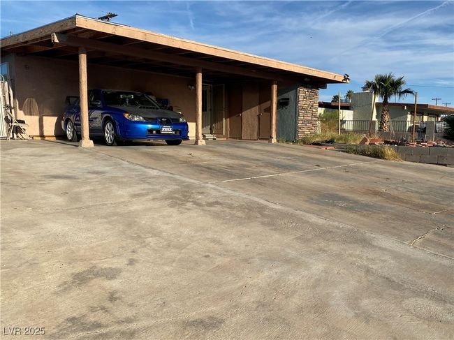 View of parking / parking lot with an attached carport | Image 41