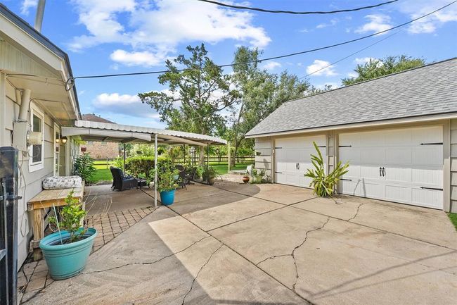 Detached two-car garage offering secure parking, additional storage space, and convenient access to the home. | Image 19