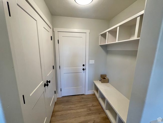 Mudroom featuring baseboards and wood finished floors | Image 6