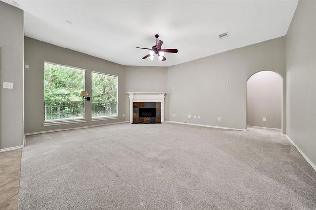 A grand family room allows for easy furniture arrangement options. | Image 15