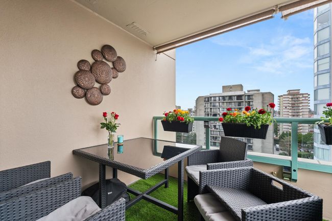 Balcony with a view of city and visible vents | Image 31
