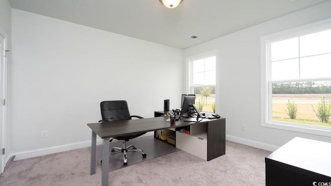 Home office featuring light colored carpet and baseboards | Image 30