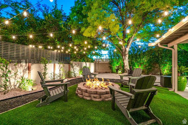 View of yard with an outdoor fire pit | Image 22