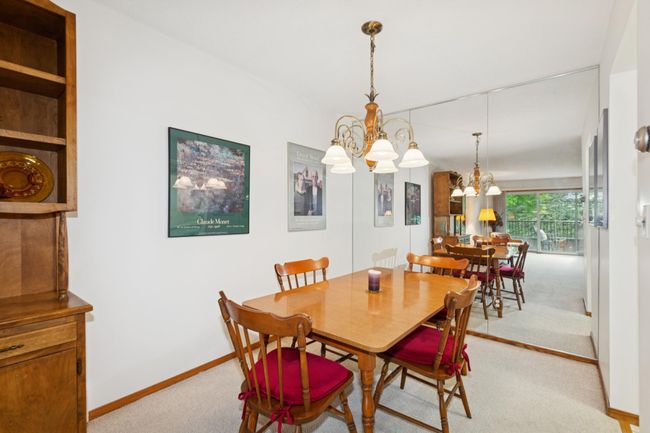 Separate dining room with mirrored wall to reflect light | Image 6