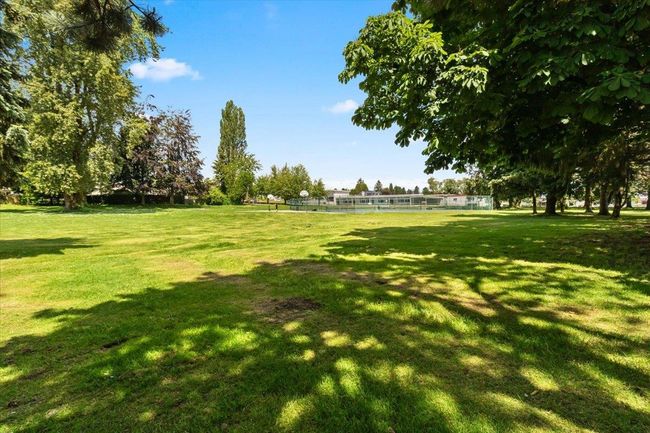 View of home's community with a lawn | Image 40