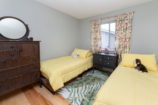 Bedroom featuring wood finished floors | Image 19
