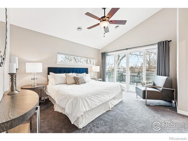 the primary suite is a true sanctuary, with panoramic views, a luxurious ensuite bath, and a spacious walk-in closet. step onto the expanded deck, perfect for morning coffee or late-night stargazing, with stairs down to the hot tub. | Image 4