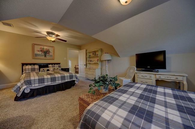 One of the two large second floor bedrooms. Great spot for young children. | Image 39