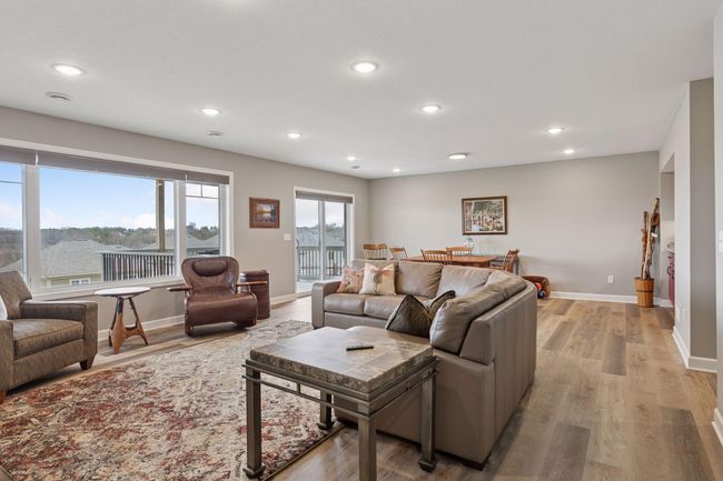 Basement was professionally finished shortly after purchasing, they added a 2nd deck, family room, wet bar, 3rd bedroom, cedar closet space, craft room, and kept a large unfinished storage space | Image 35