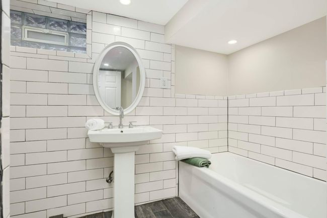 Lower Level full bath has tub and separate tile shower! | Image 22