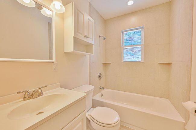 Bathroom featuring vanity, shower / washtub combination, and recessed lighting | Image 13
