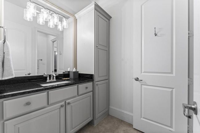 Secondary Bath, sleek counters and modern lighting | Image 27