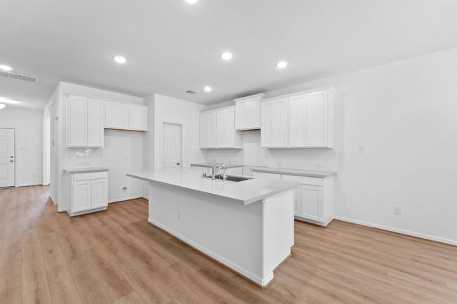 This kitchen is not only a functional space but also has ample storage. Whether you're a seasoned chef or just love to gather and enjoy good food, this kitchen is a dream come true. | Image 9