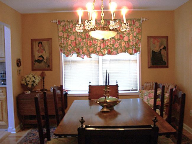 Dining area featuring plenty of natural light and a chandelier | Image 10