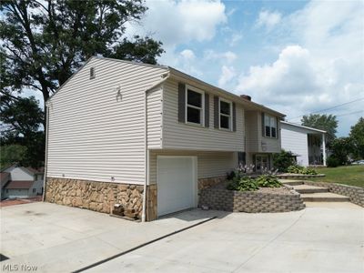 View of property exterior featuring a garage | Image 3