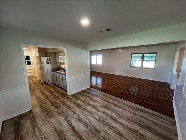 Enjoy this spacious dining area that seamlessly unites that kitchen and living area | Image 8