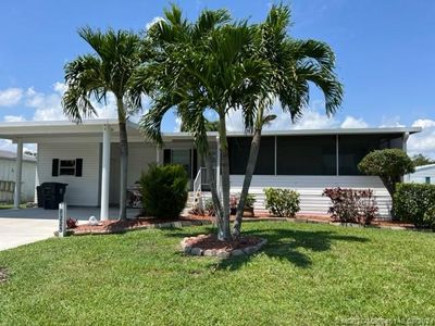 6225 Holly Lane, House other with 3 bedrooms, 2 bathrooms and 2 parking in Lantana FL | Image 1