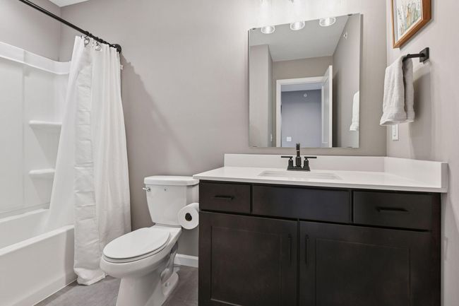 The upper level Junior Bedrooms share a full bathroom. | Image 16