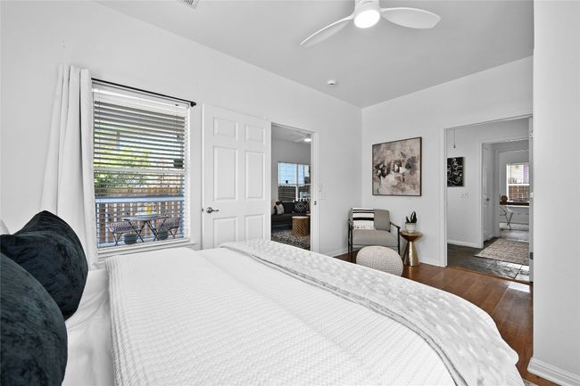 A bright and roomy primary bedroom with attached shared bath. | Image 14