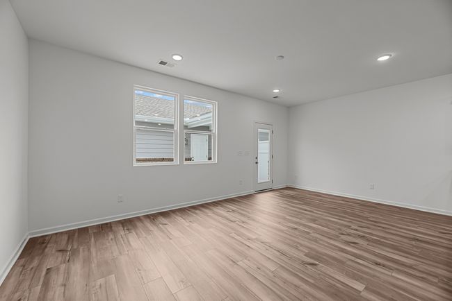 Back door opens to a private courtyard patio. Beyond that you will have your 2 car detached garage | Image 16