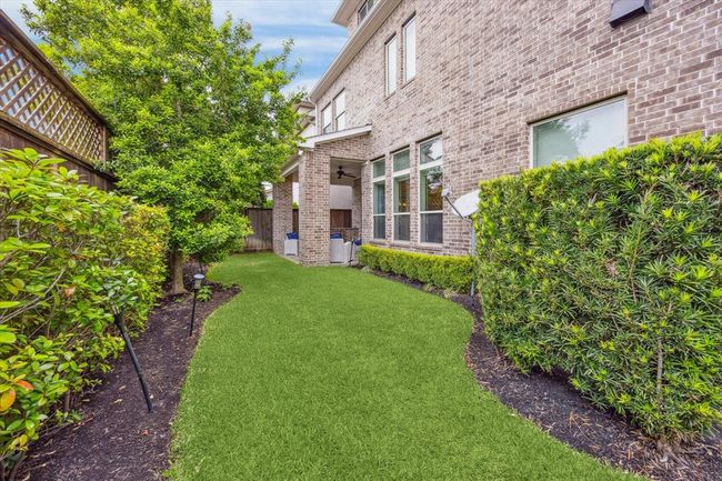 The backyard has space for children to play, dogs to run, and a space to relax. The HOA fee includes water and trash, yard & gate maintenance, and community pool. | Image 35