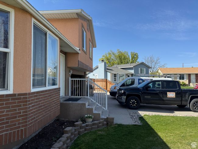 View of side of property with a lawn, brick siding, and stucco siding | Image 16