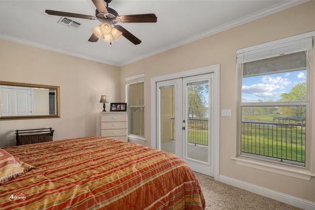 2nd floor bedroom opening to balcony. | Image 33