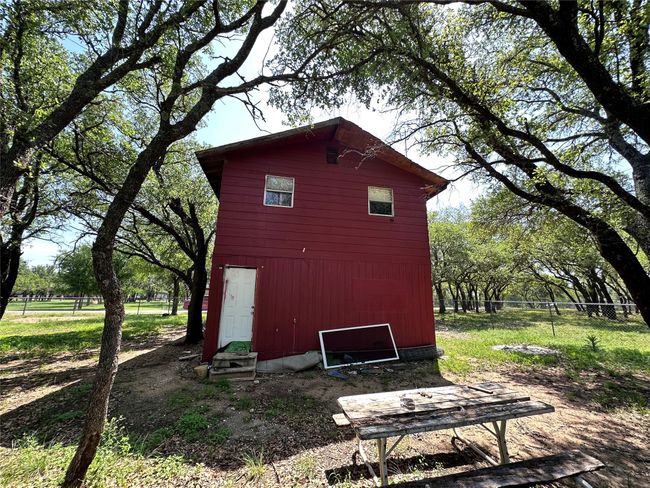 View of outbuilding featuring fence and an outbuilding | Image 4