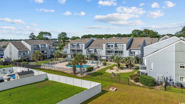 Aerial perspective of suburban area featuring a pool | Image 30