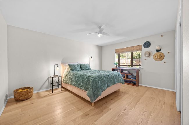 The first-floor primary bedroom is spacious with double closests | Image 15